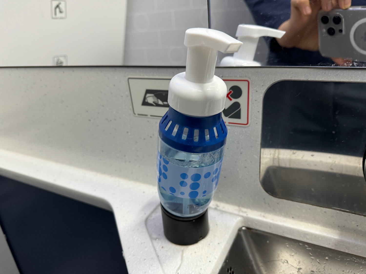 a soap dispenser on a sink