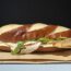 a sandwich on a paper plate