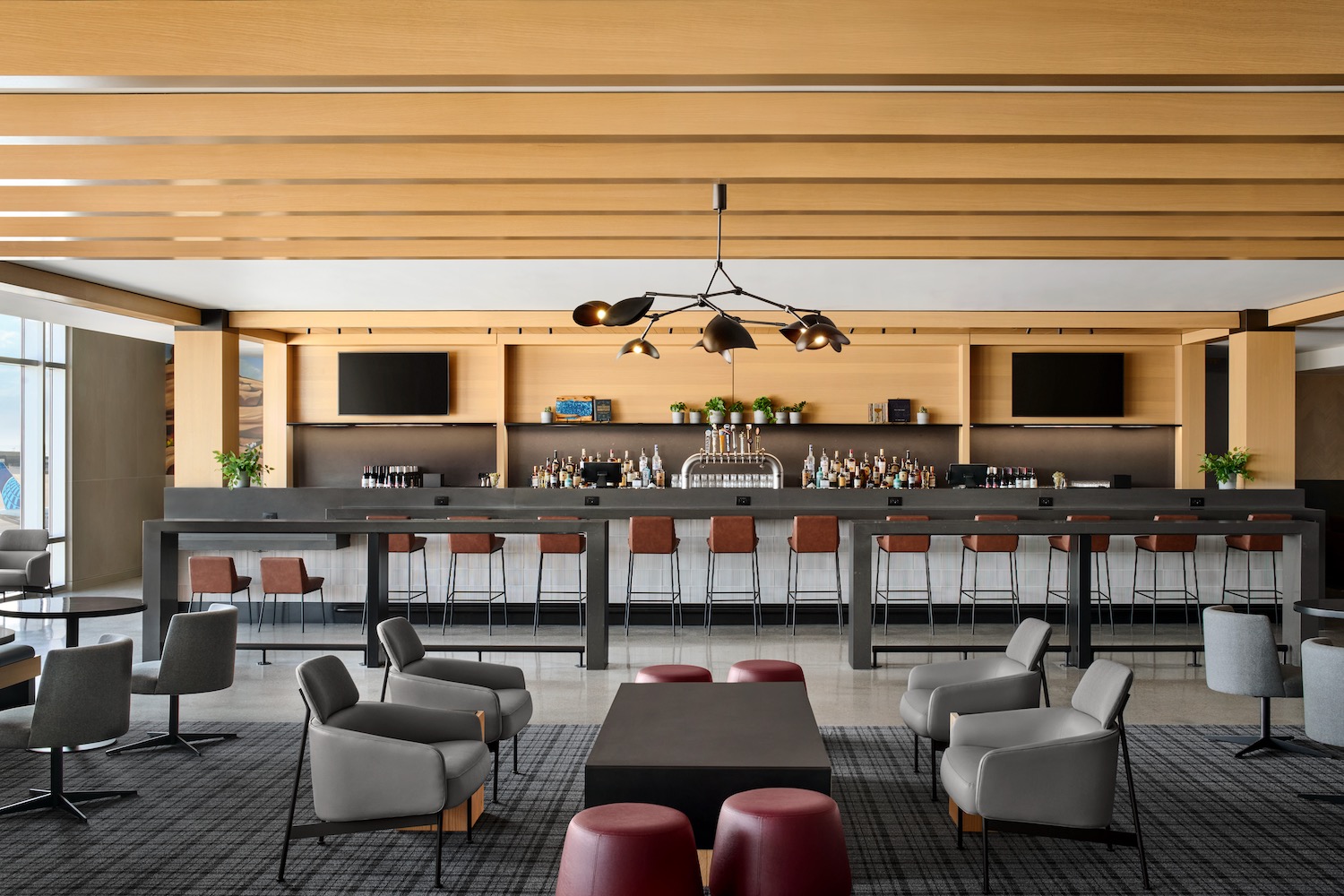 a bar with a counter and chairs