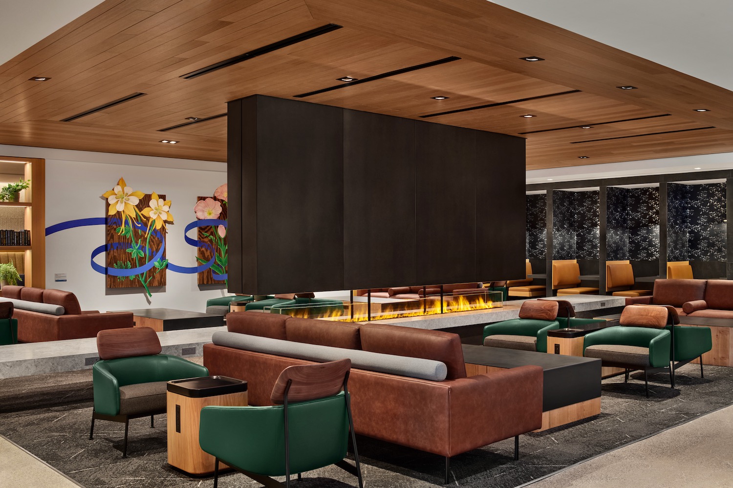 a room with a fireplace and couches