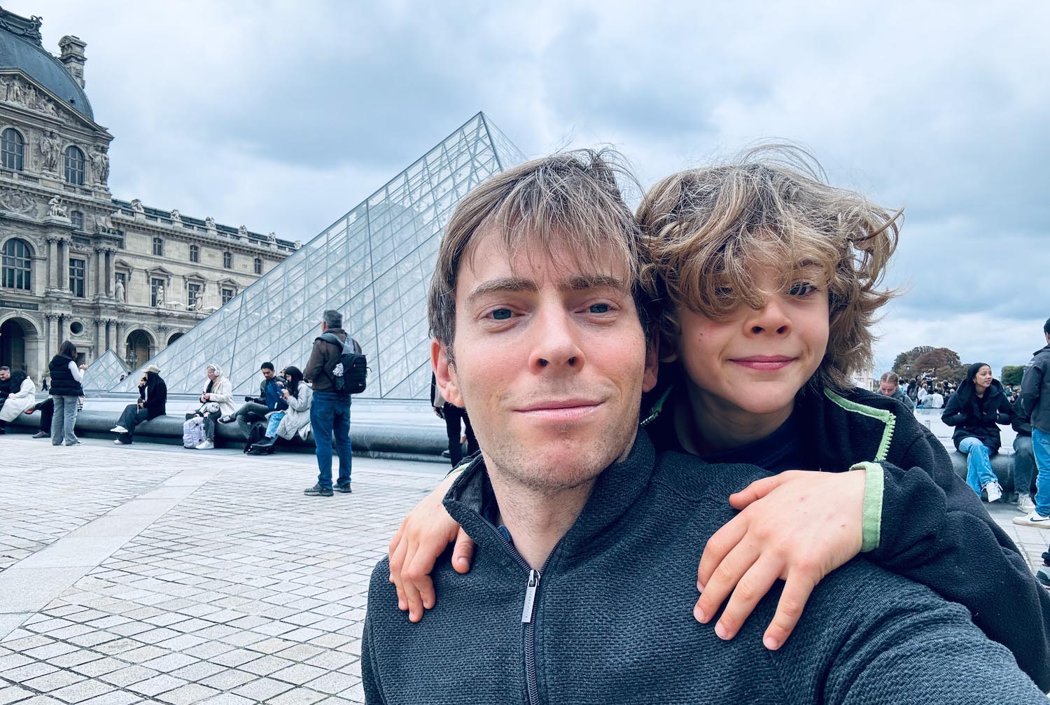a man and child taking a selfie