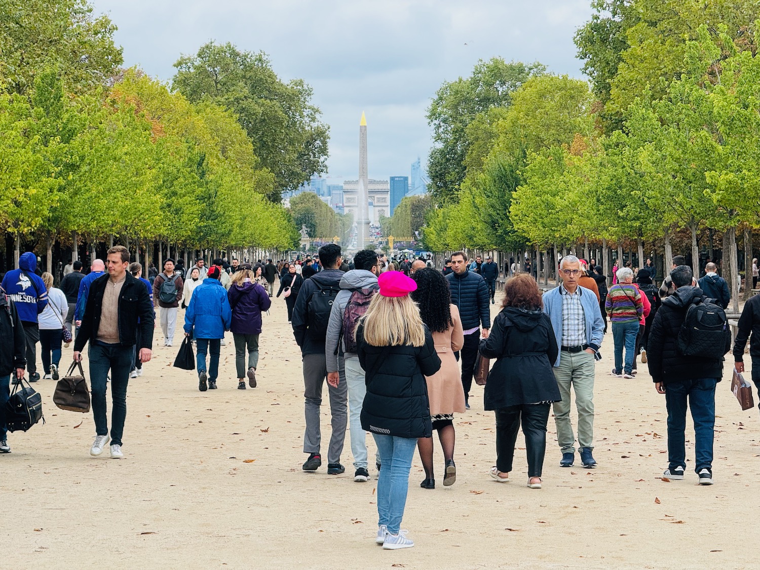 a group of people walking in a park