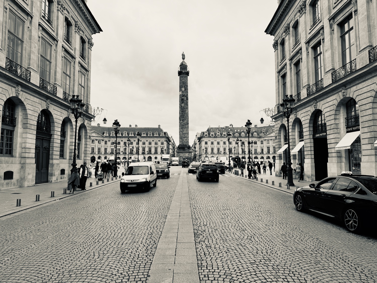 a street with cars and a tall tower