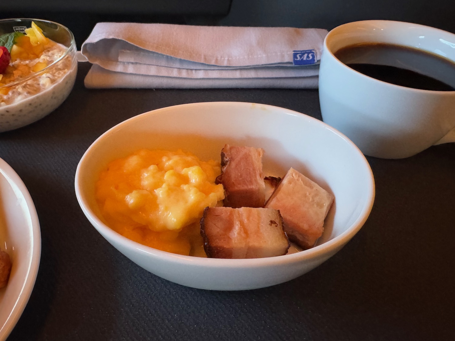 a bowl of food and a cup of coffee