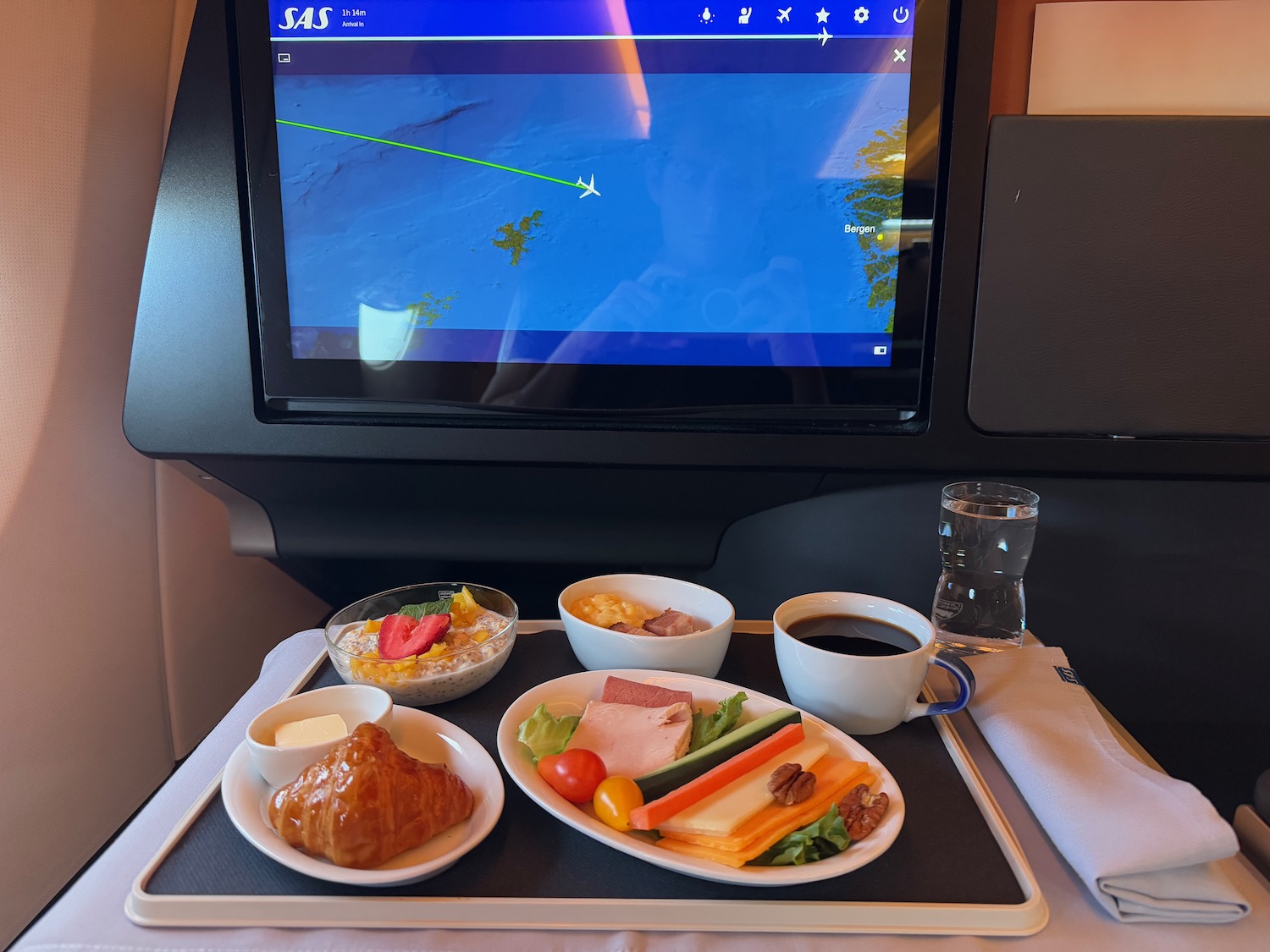 a tray with food and a television on it