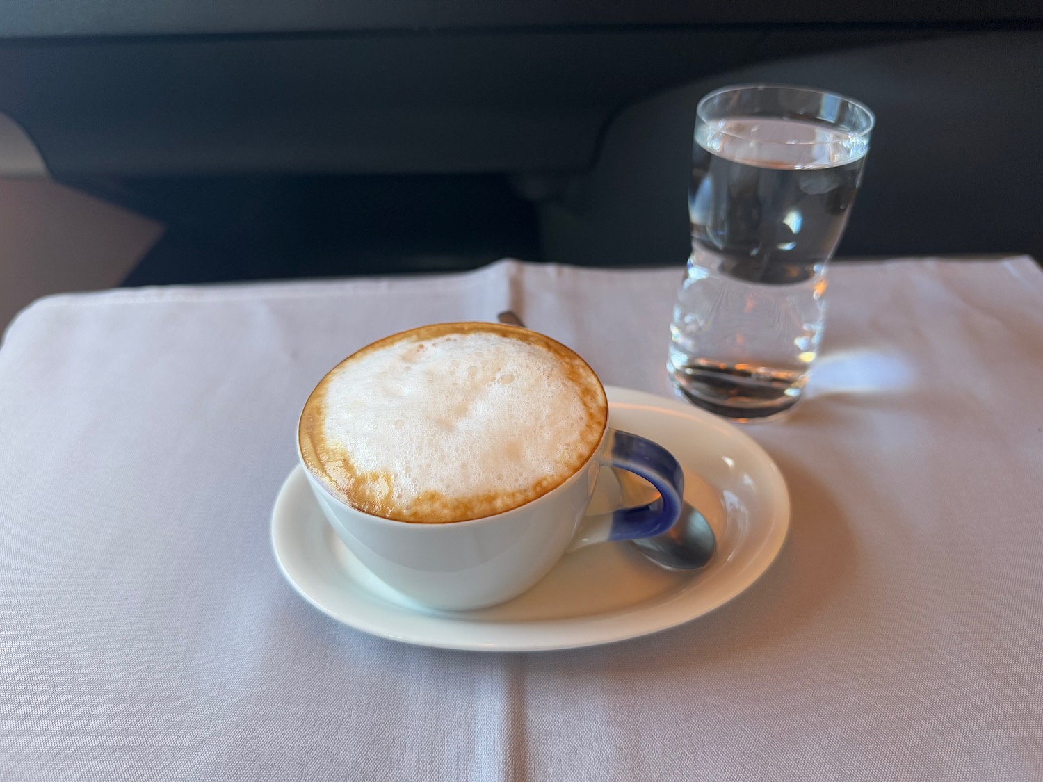 a cup of coffee and a glass of water