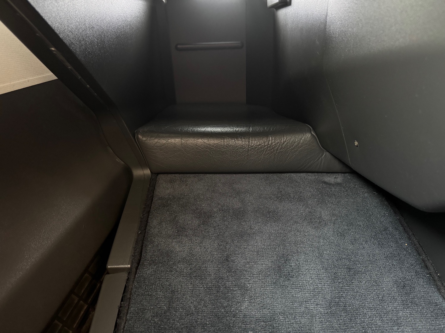 a carpeted floor in a vehicle