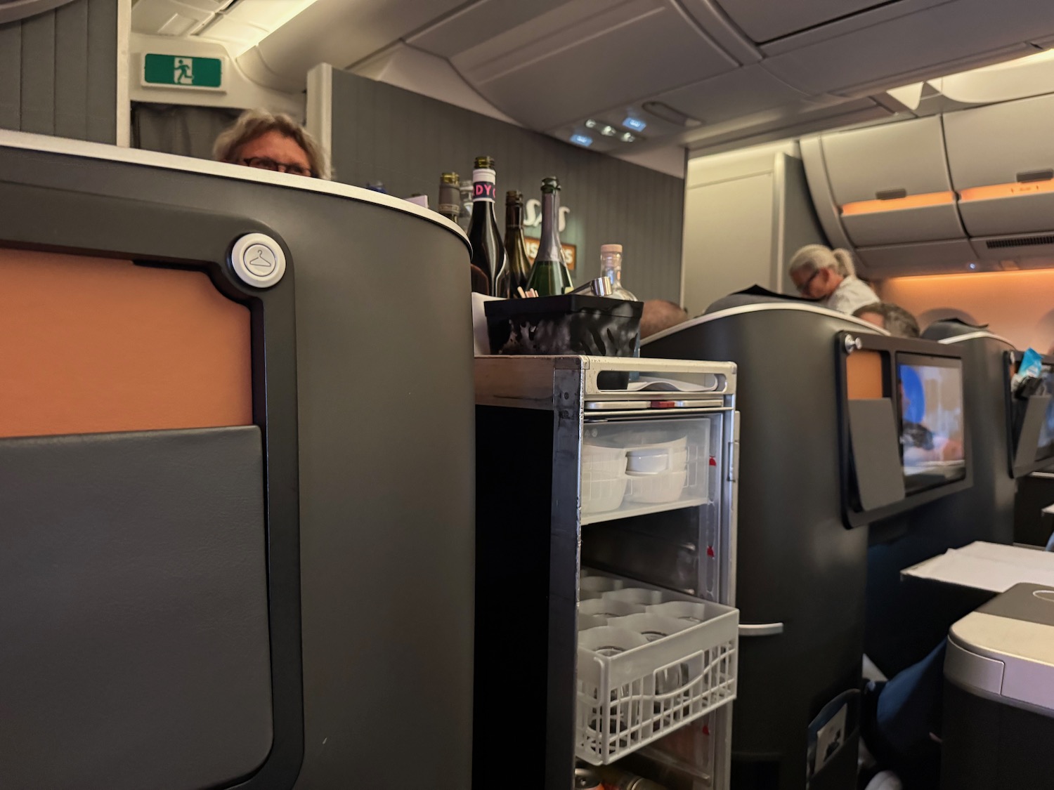 a group of people sitting in an airplane