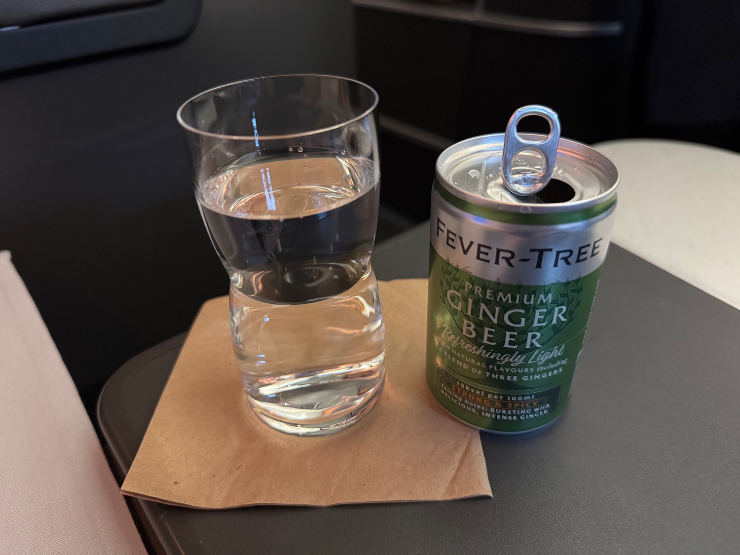 a glass of water and a can of beer