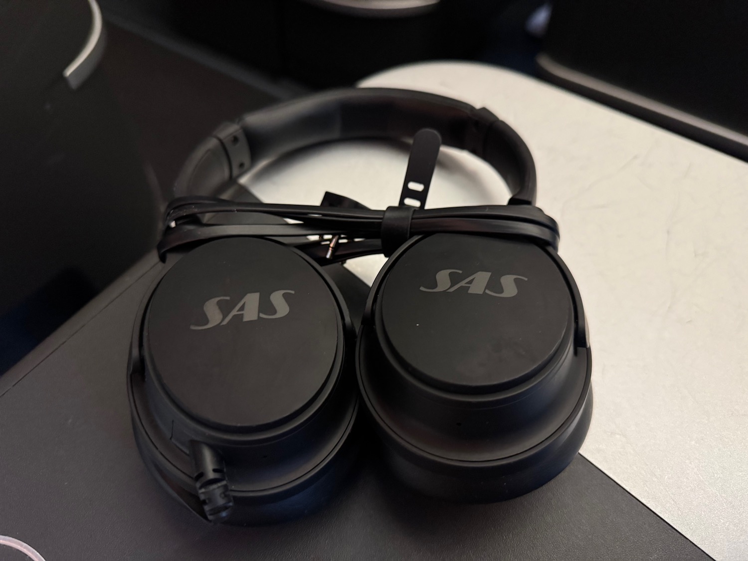 a pair of black headphones on a table