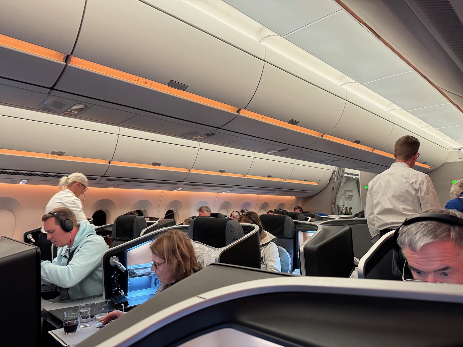 a group of people sitting in an airplane