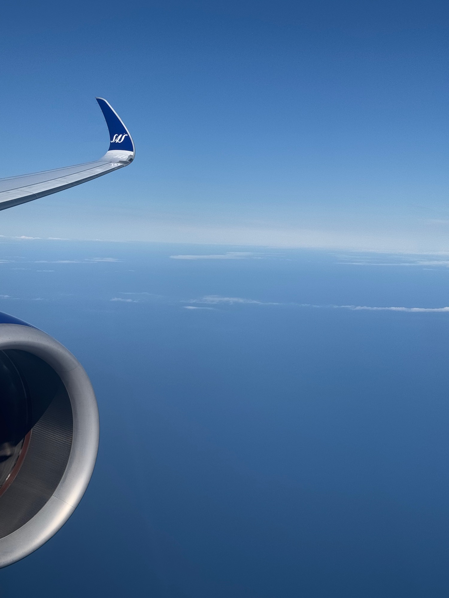 an airplane wing and the sky