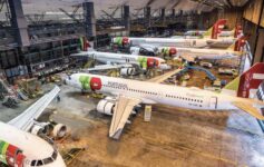 several airplanes in a hangar