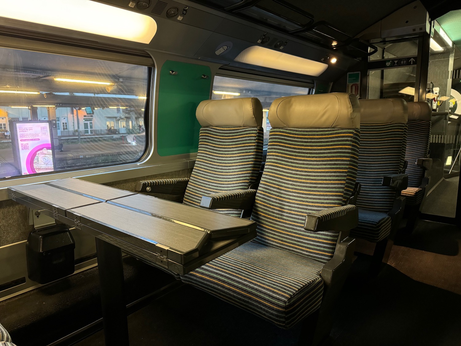 a table and chairs in a train