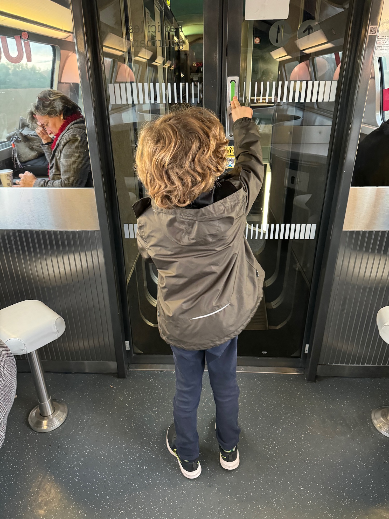 a child standing in an elevator