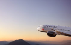 a plane flying over mountains