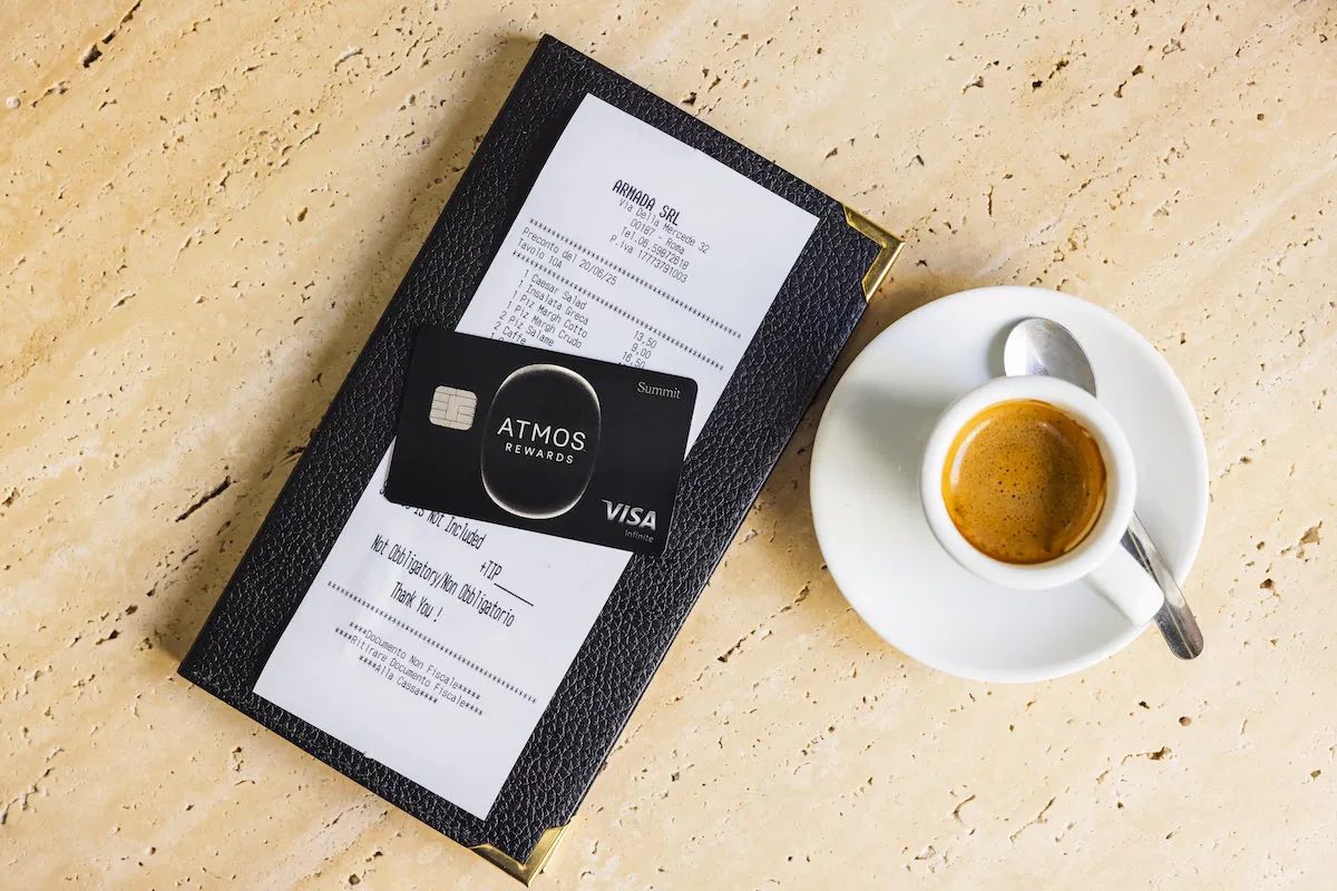 a credit card and a menu on a table