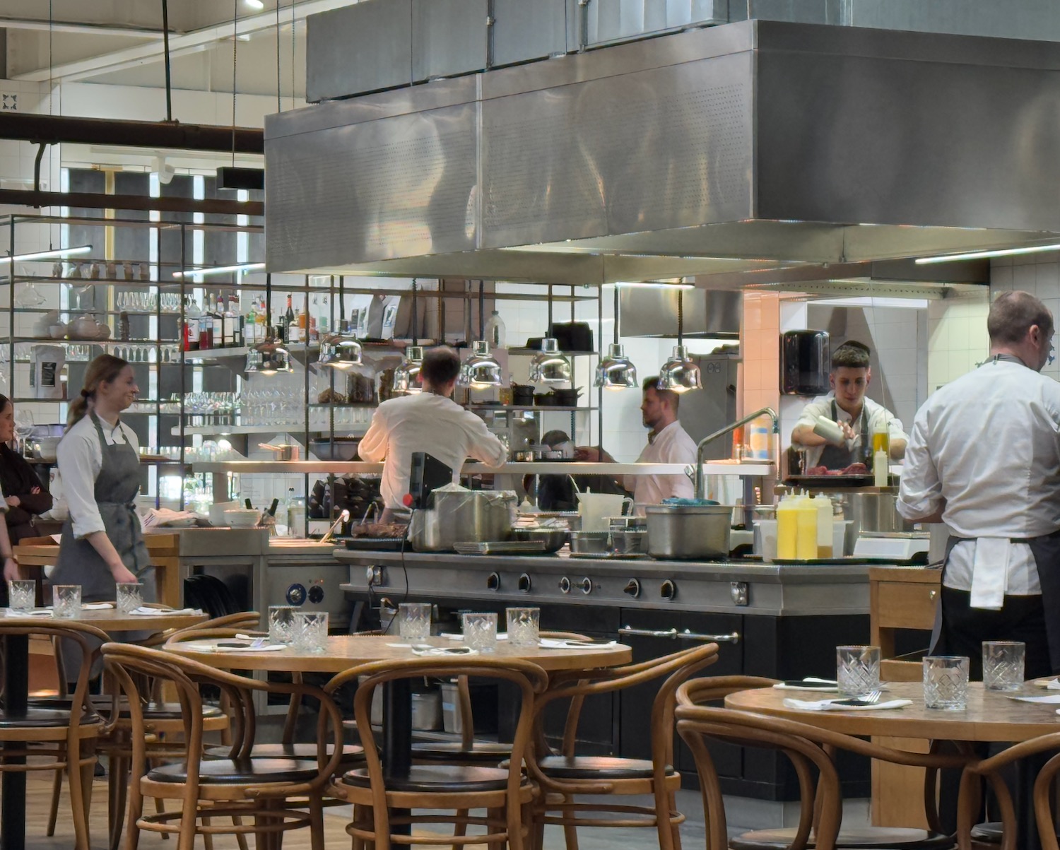 a group of people in a kitchen