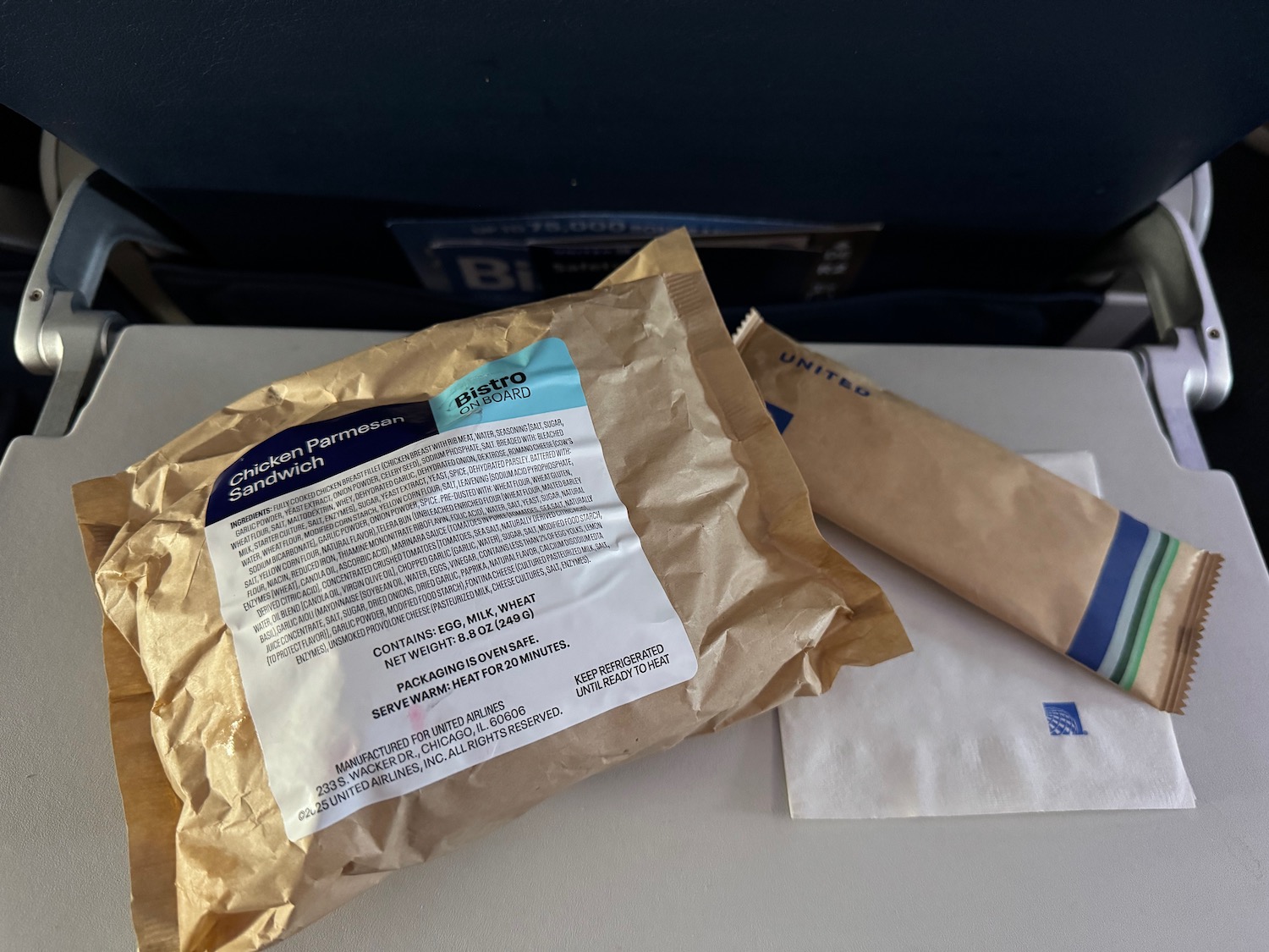 a brown bag with a white label on it next to a brown bag