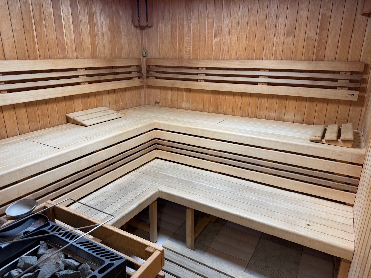 a wooden sauna with a grill