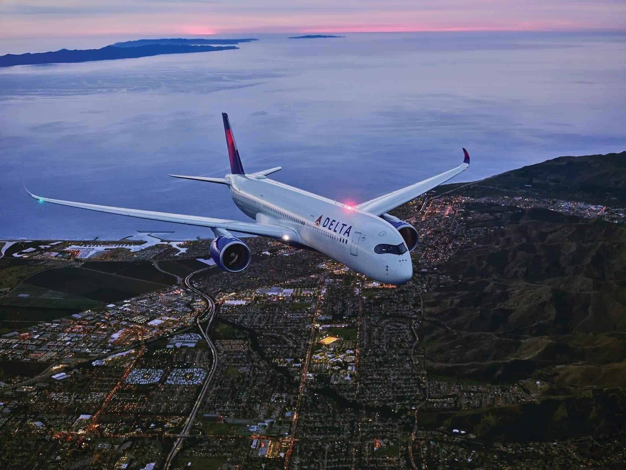 an airplane flying over a city