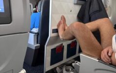 a person's legs on a plane