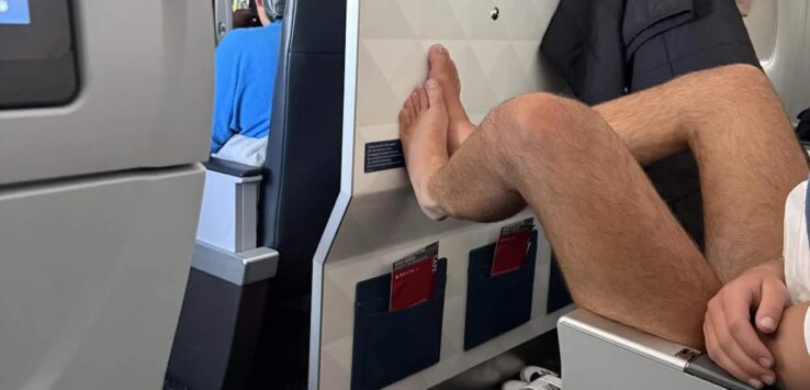 a person's legs on a plane
