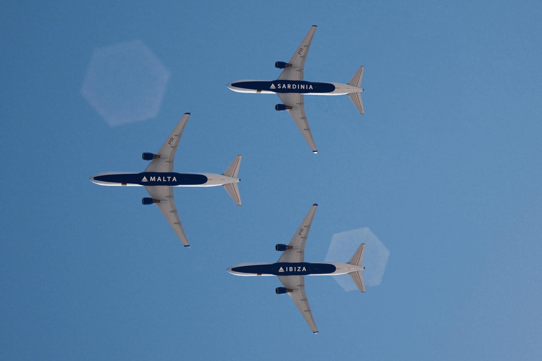 a group of airplanes in the sky