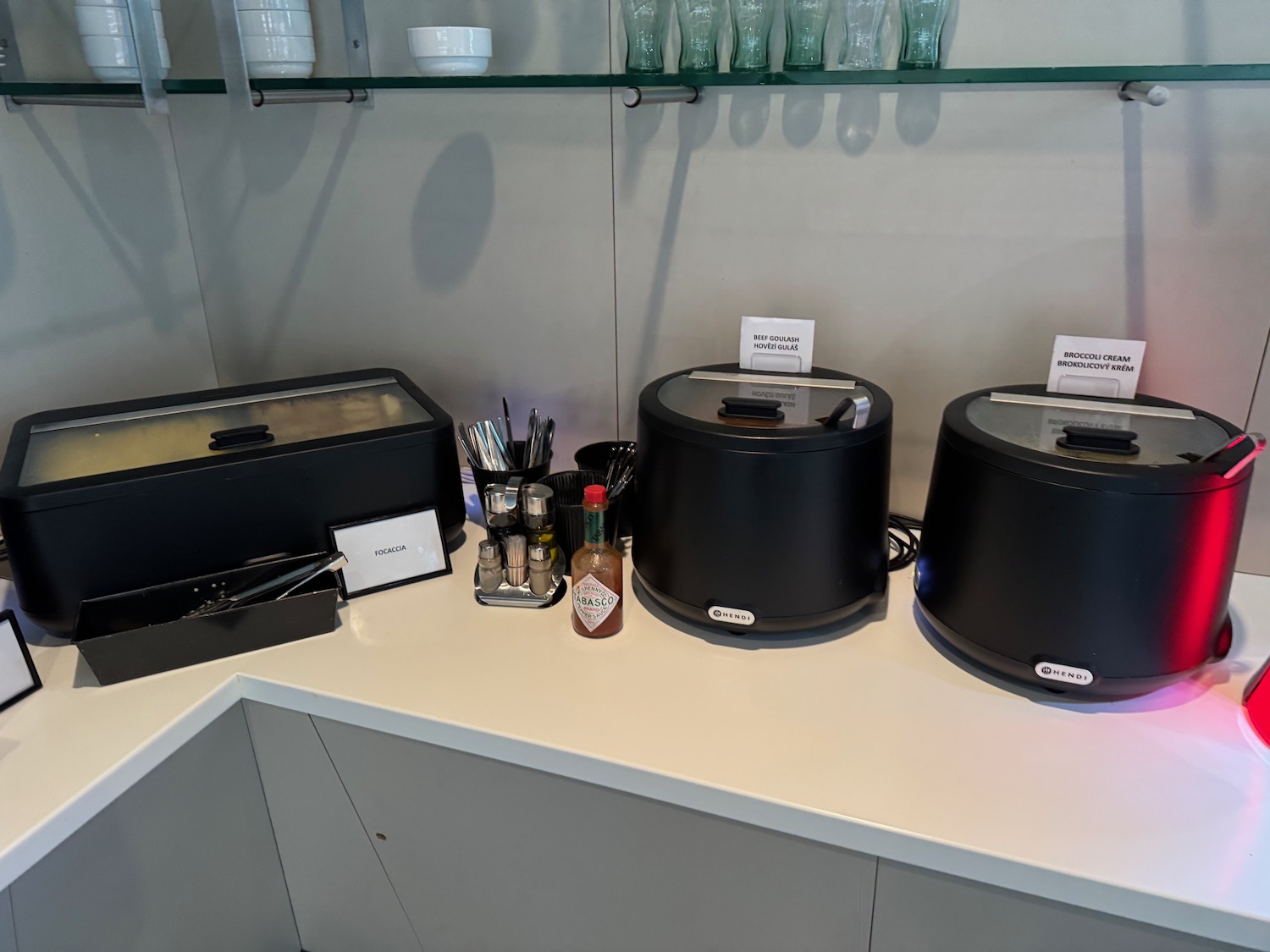 a group of black containers on a white counter