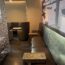 a couch with chairs and tables in a room