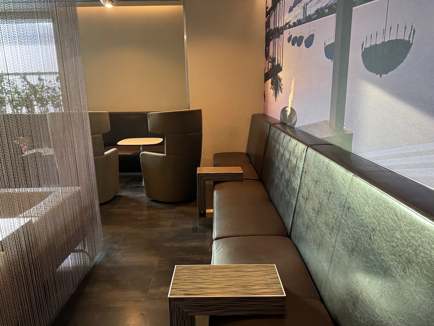 a couch with chairs and tables in a room