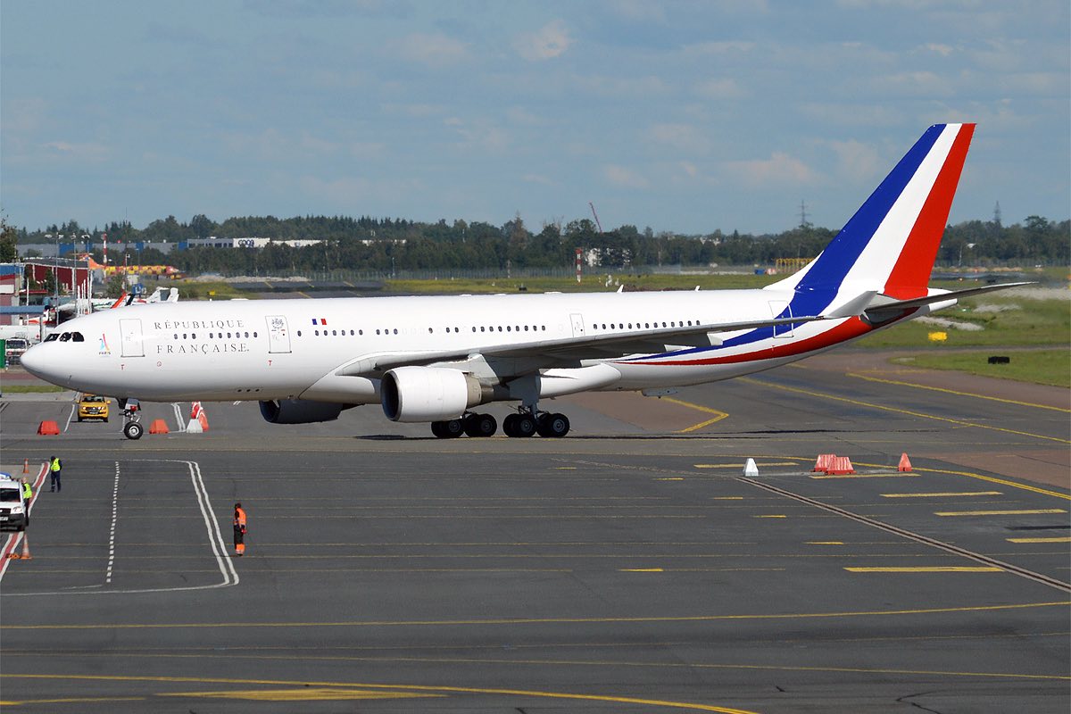 a white airplane on a runway