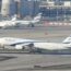 a group of airplanes on a runway