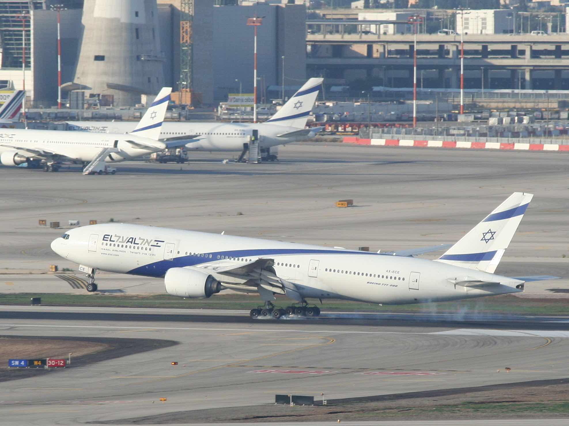 a group of airplanes on a runway