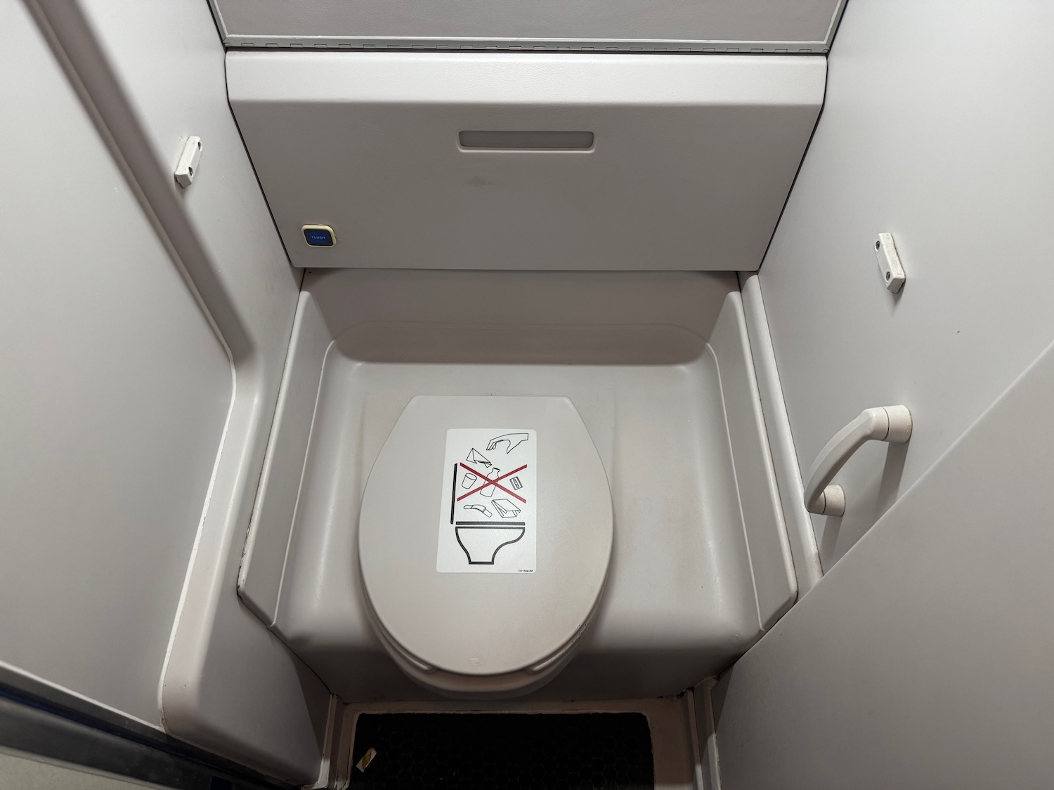 a toilet with a sticker on it