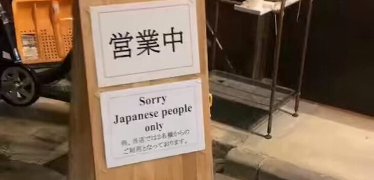 a sign on a wooden stand