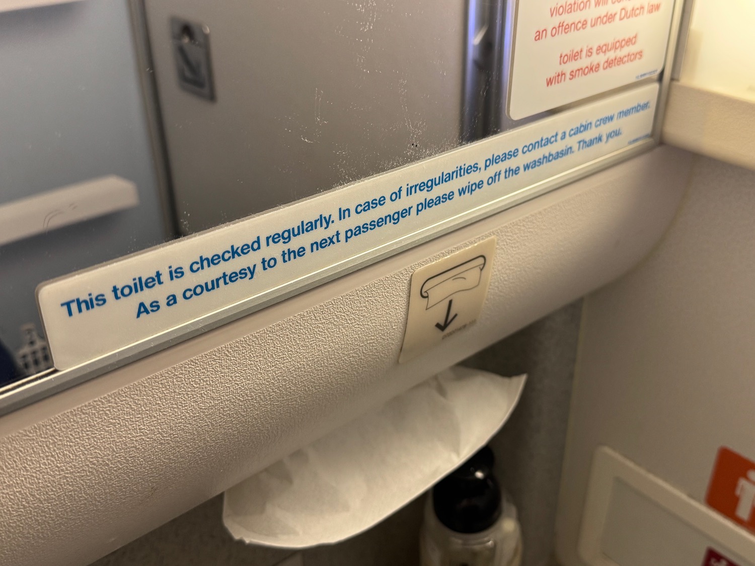 a sign on a toilet paper roll
