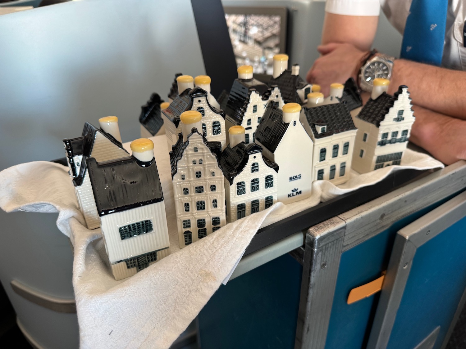 a group of small white and black houses on a white towel