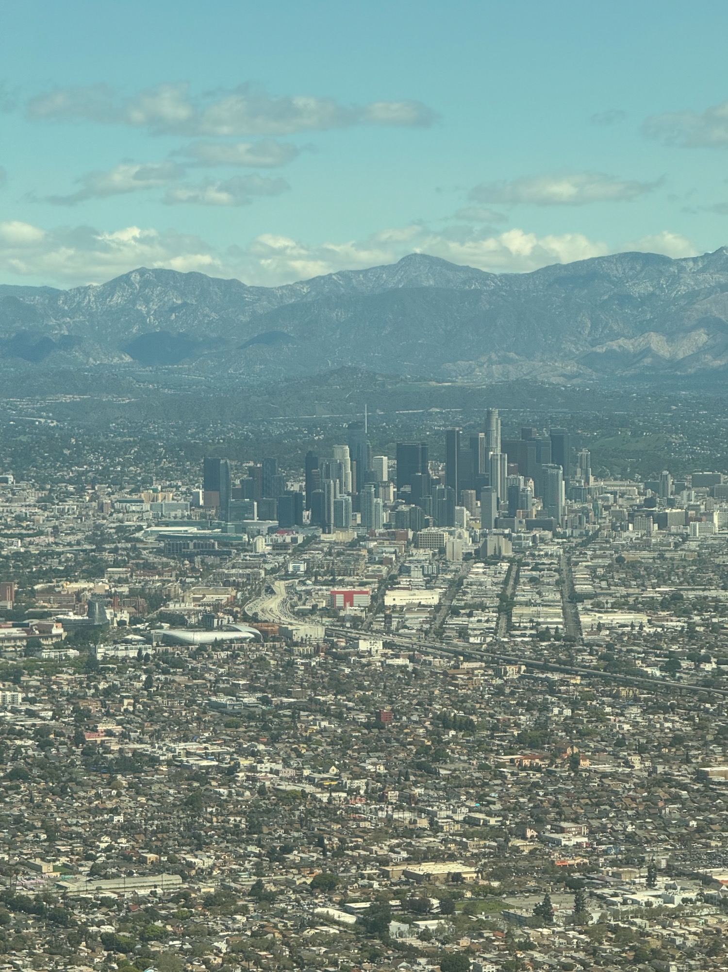 a city with mountains in the background