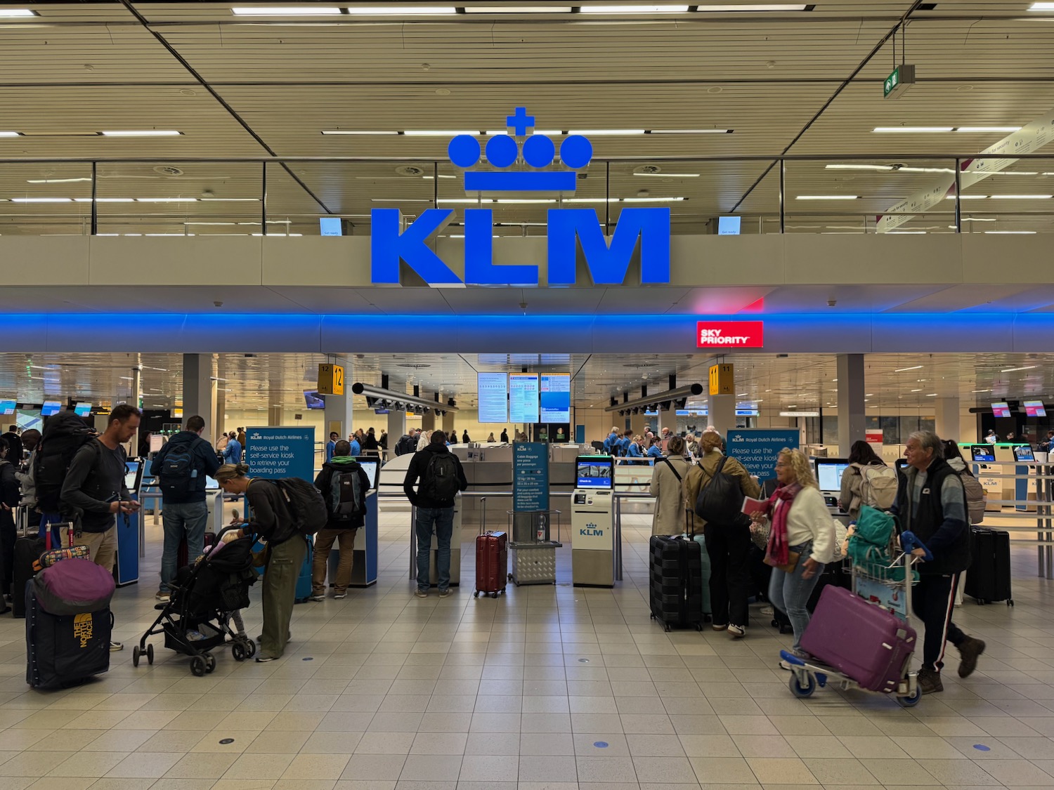 people standing in a line at an airport