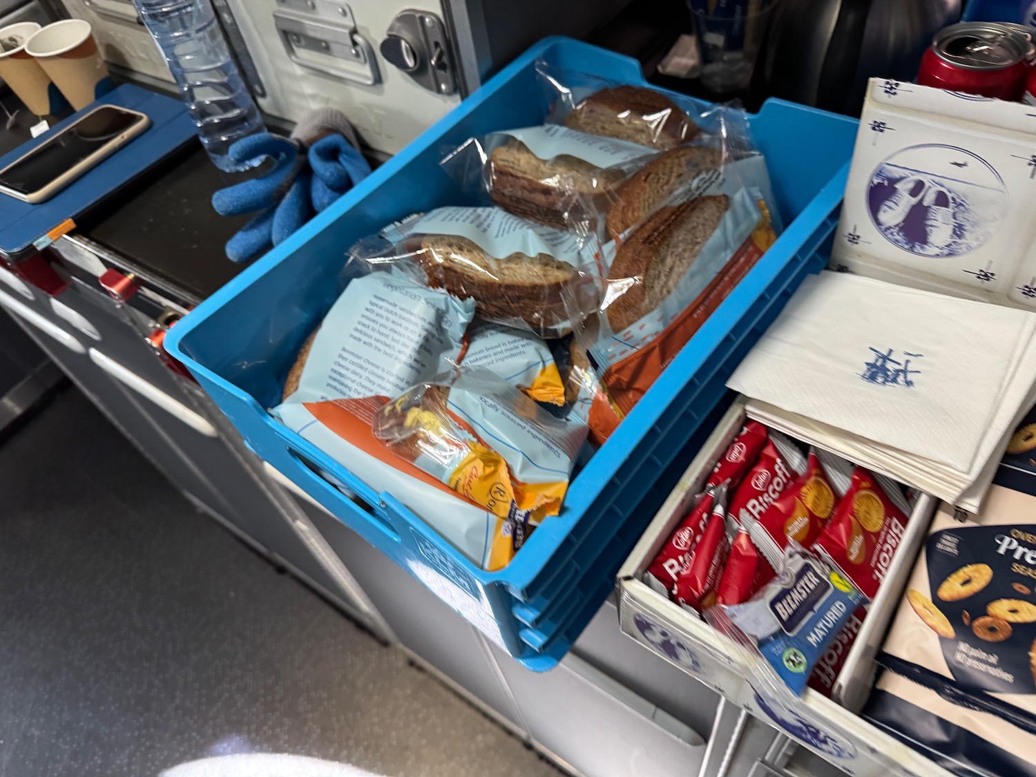 a blue basket with food in it