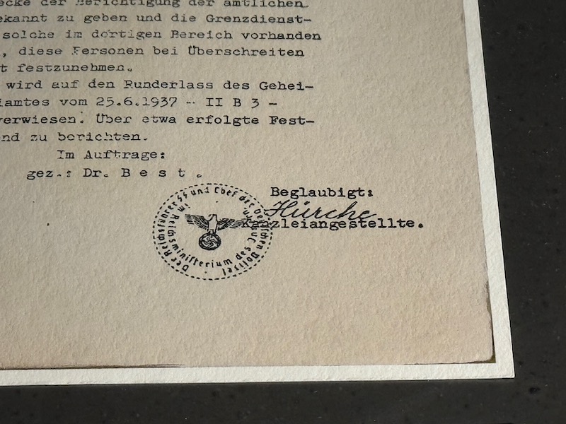 a piece of paper with a stamp and text