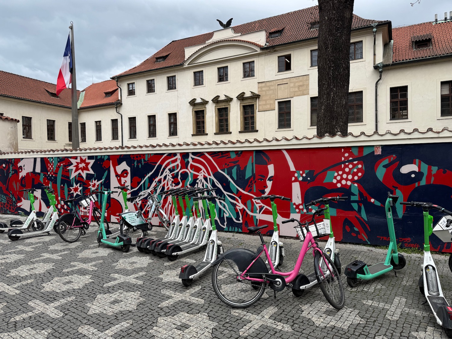 a group of bicycles parked in front of a wall