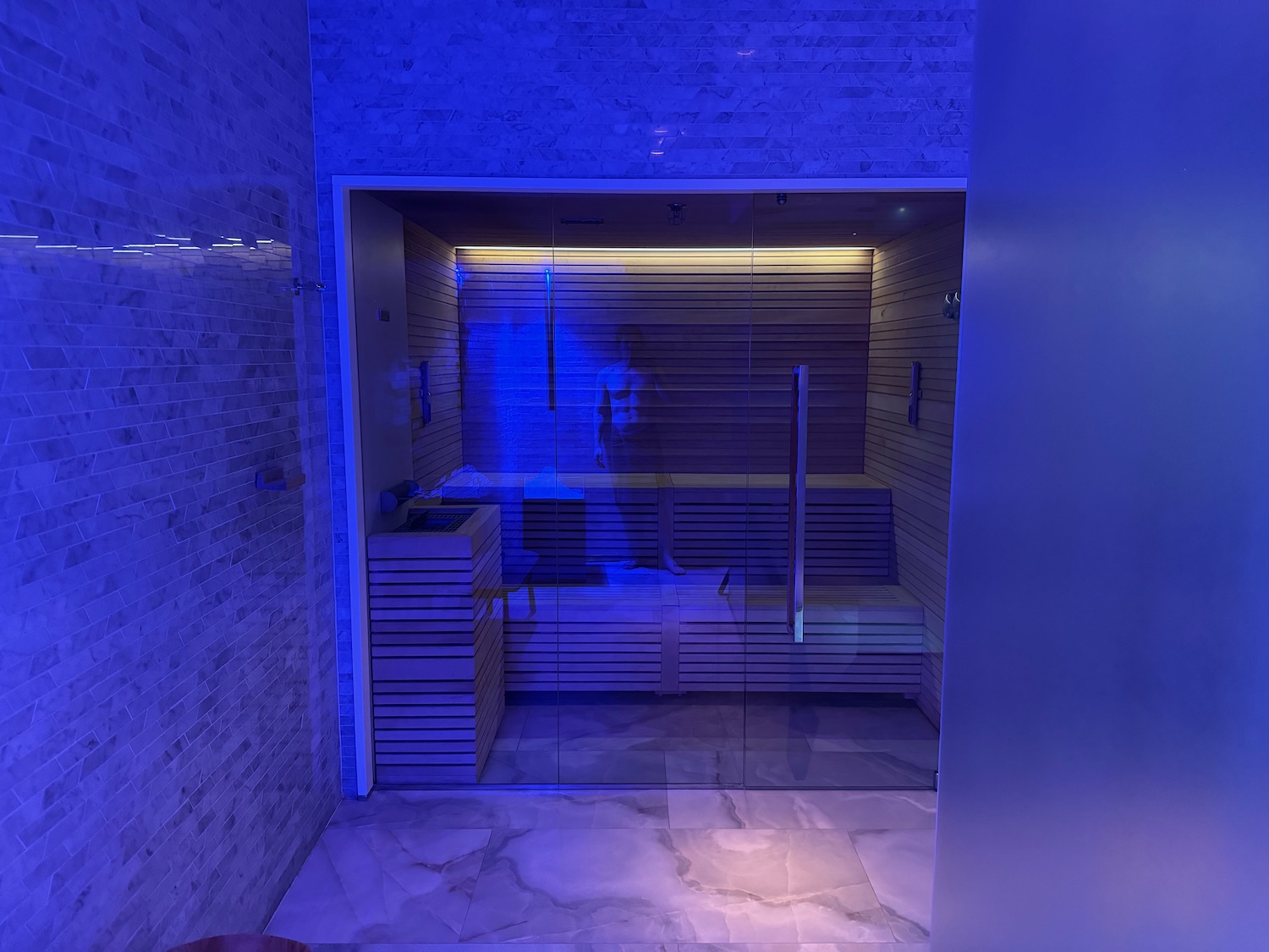 a glass door in a sauna