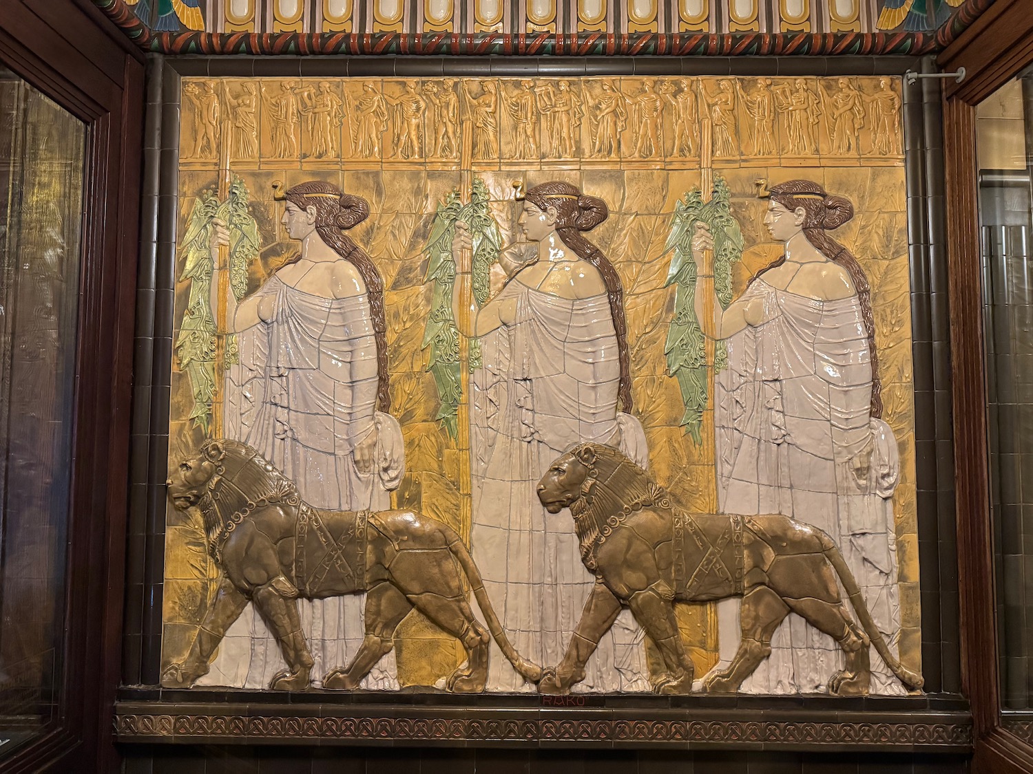 a wall art with a lion and women
