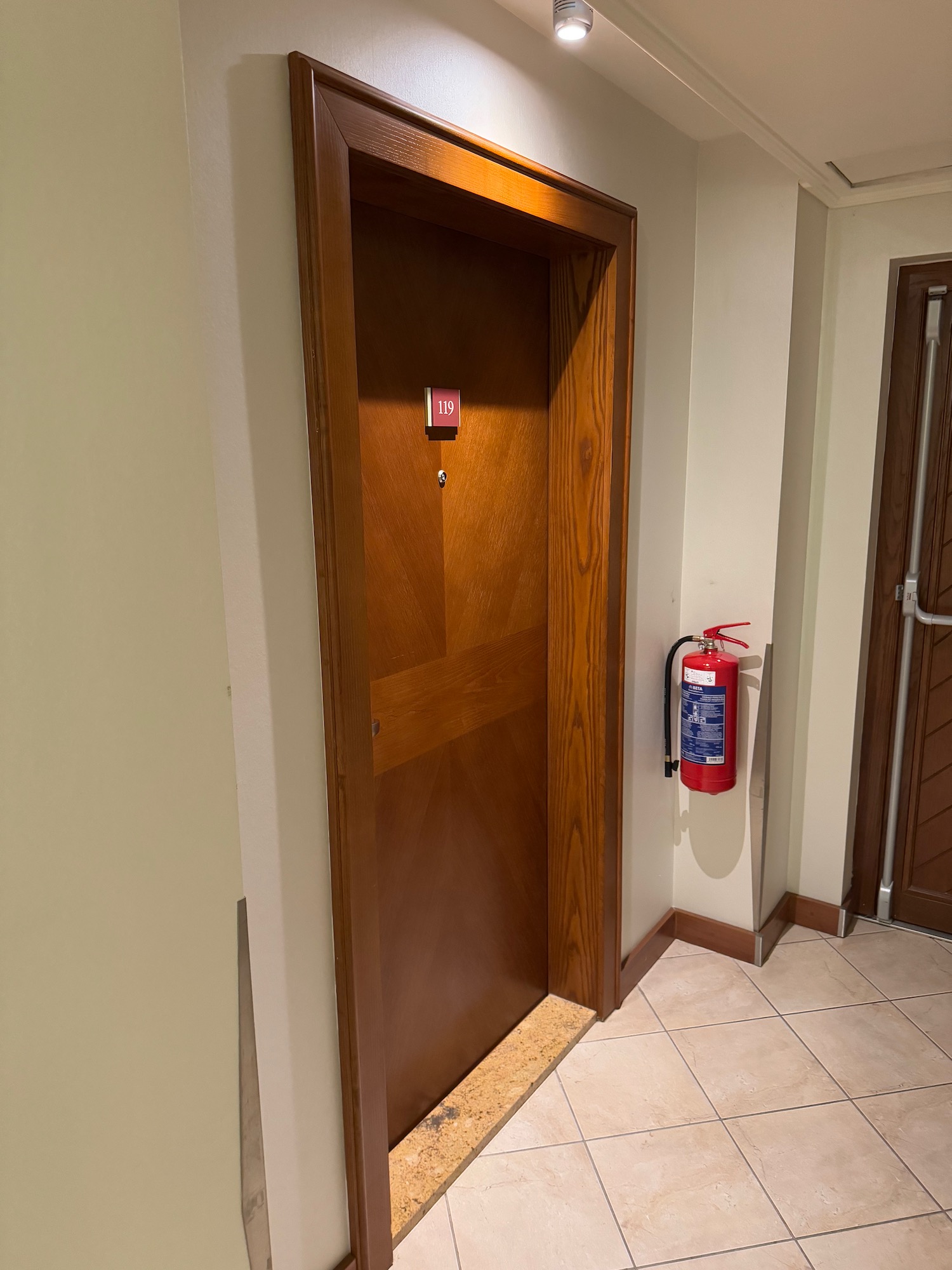 a door with a fire extinguisher