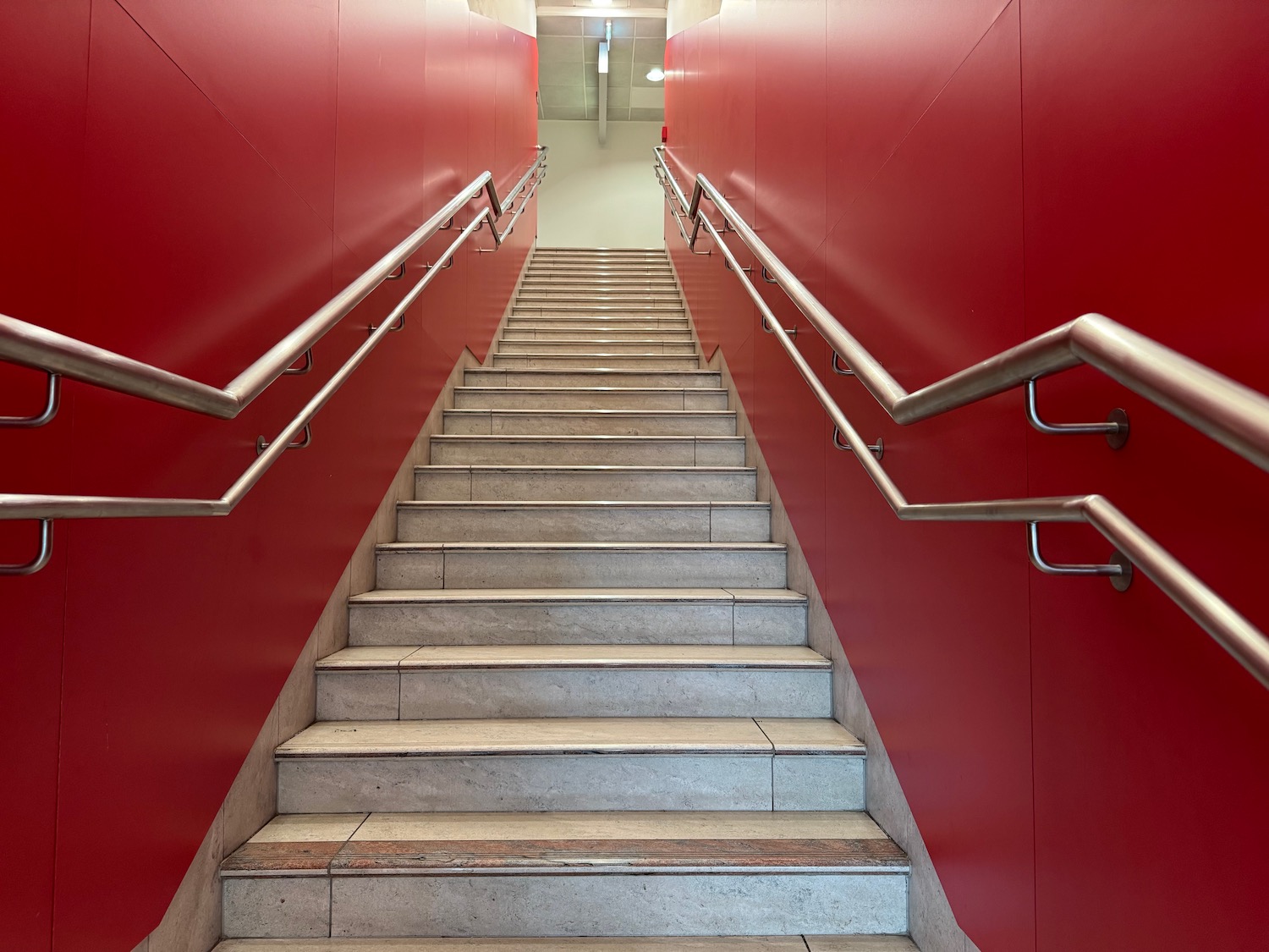 a staircase with metal handrails