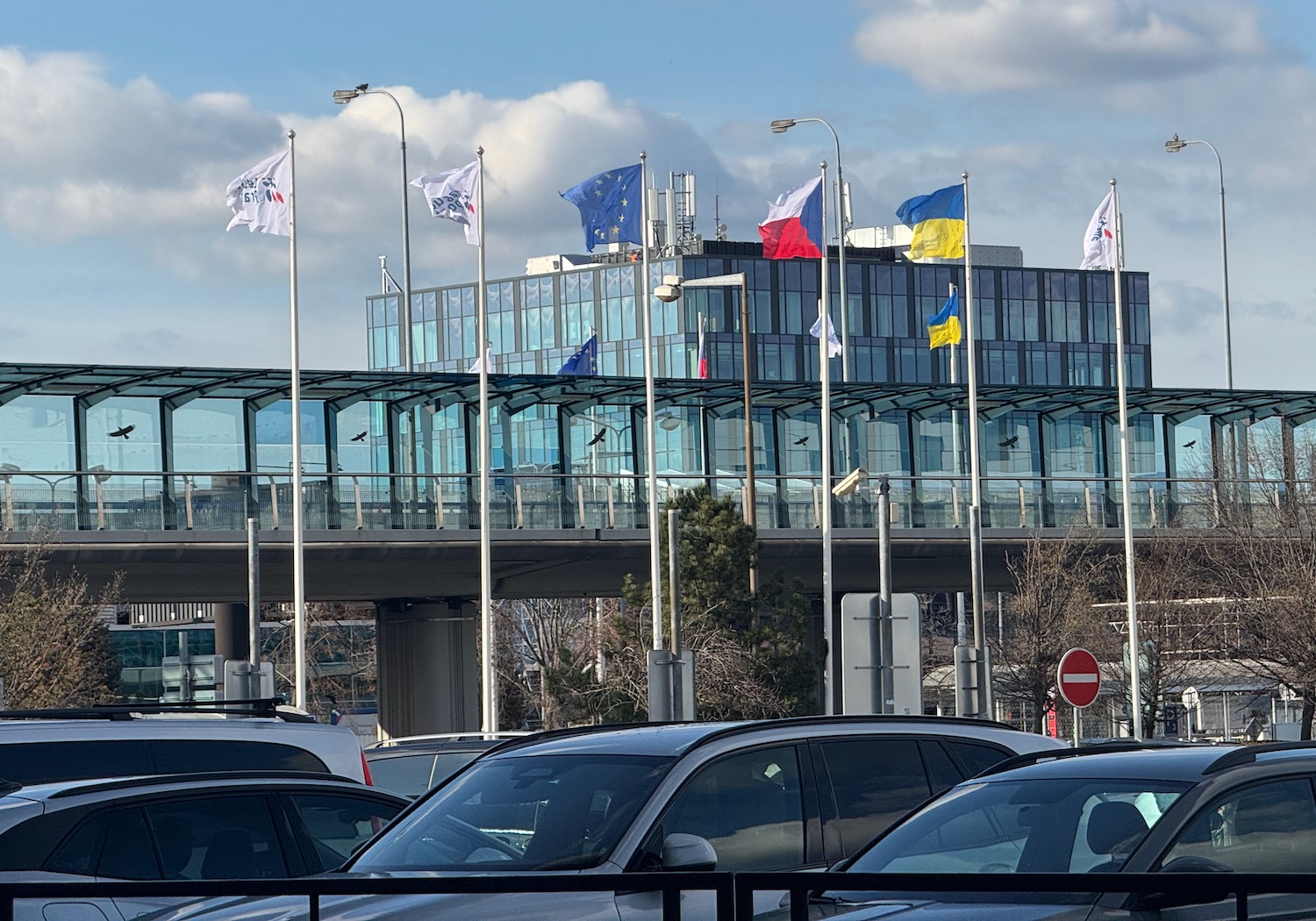 a building with flags on poles