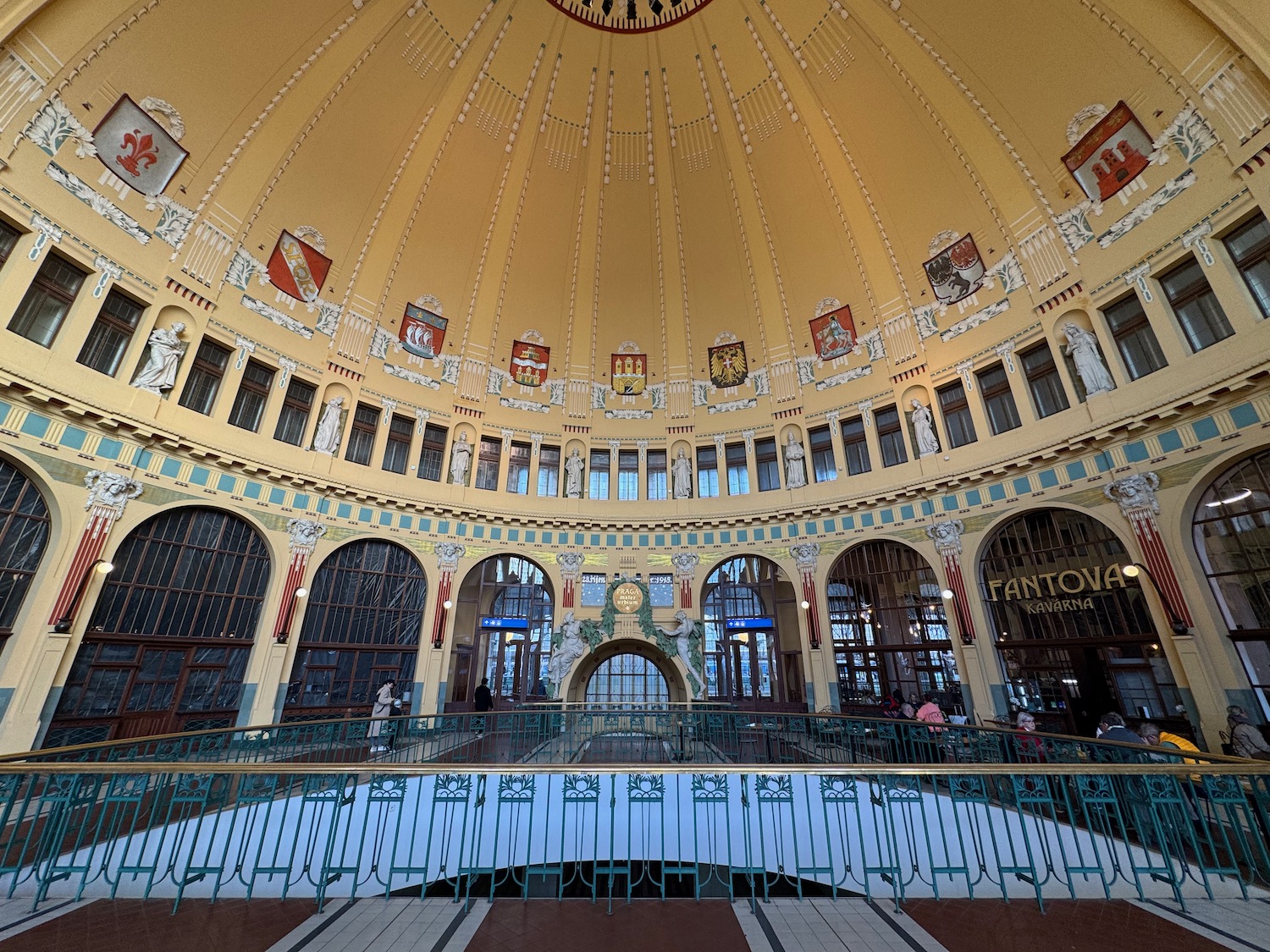 a large circular building with a railing and a balcony