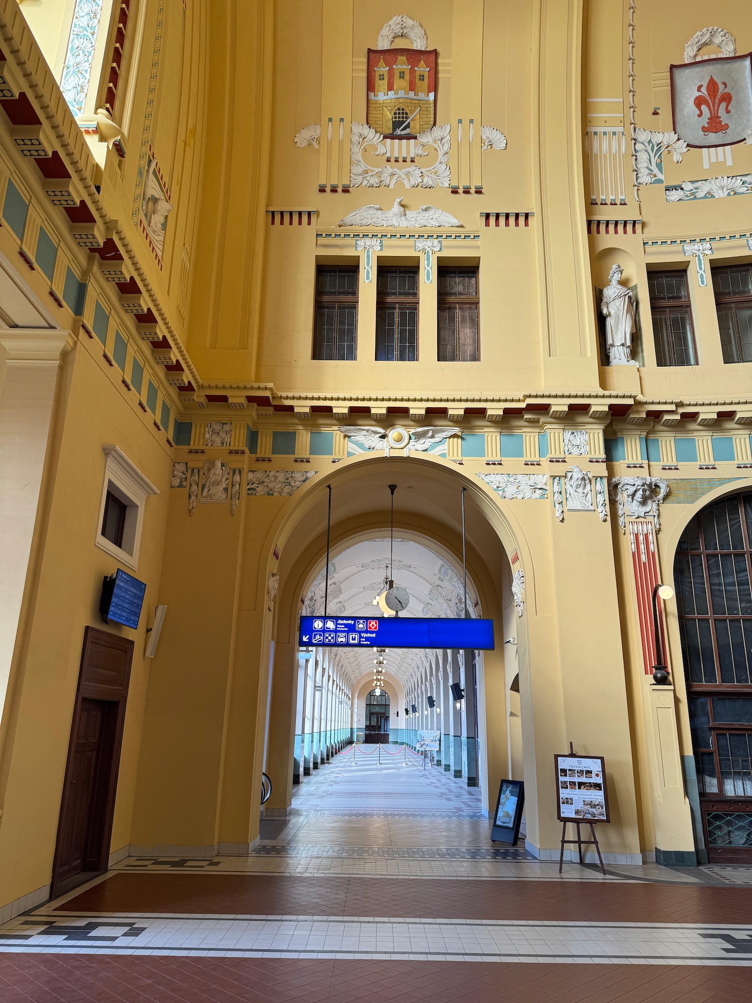a hallway with a blue sign